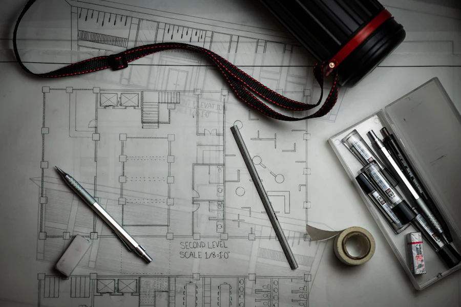 Architectural blueprints and drawing tools on a desk