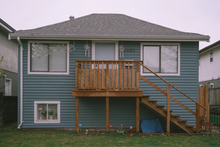 Blue house exterior with a timber deck